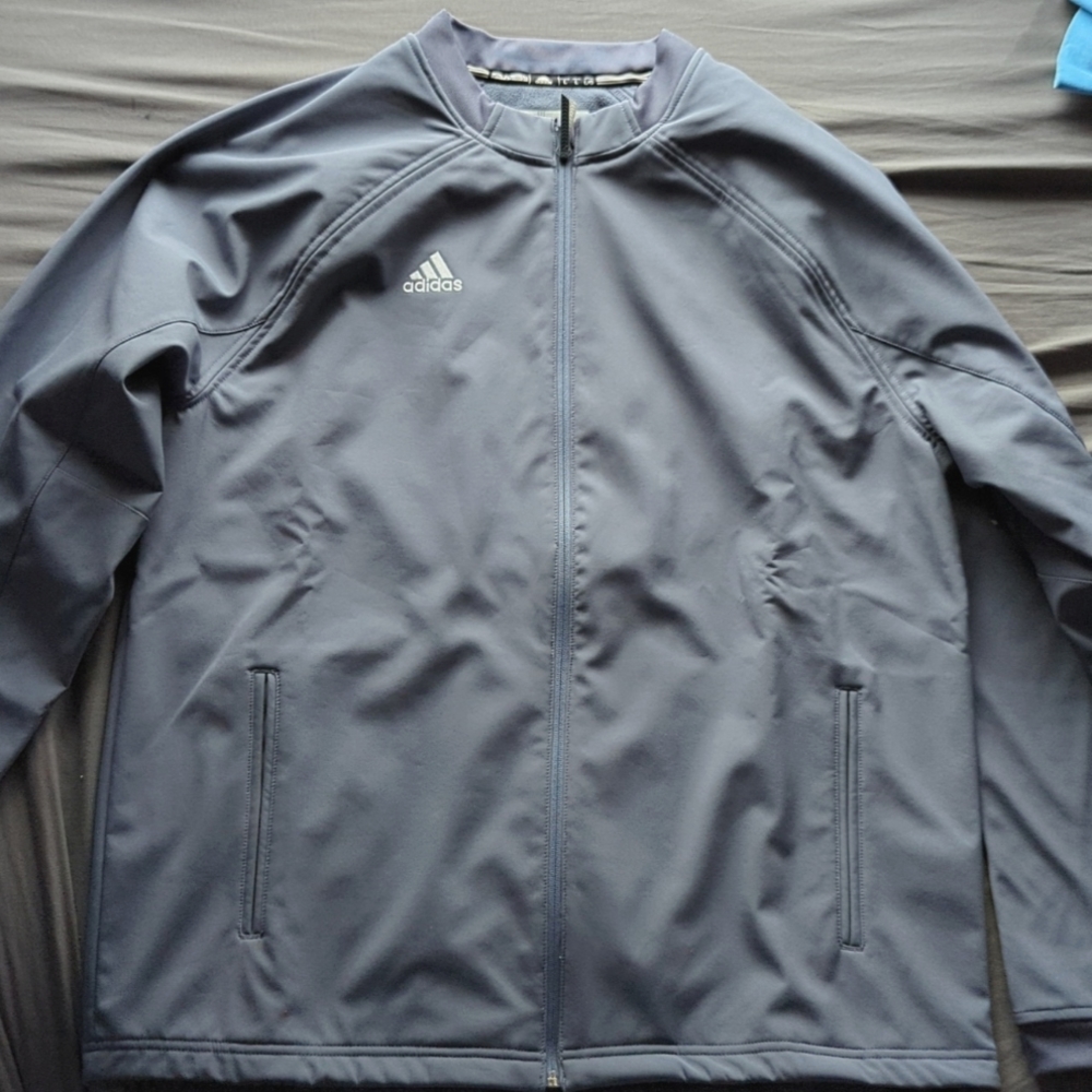 A brand new Adidas zip up jacket